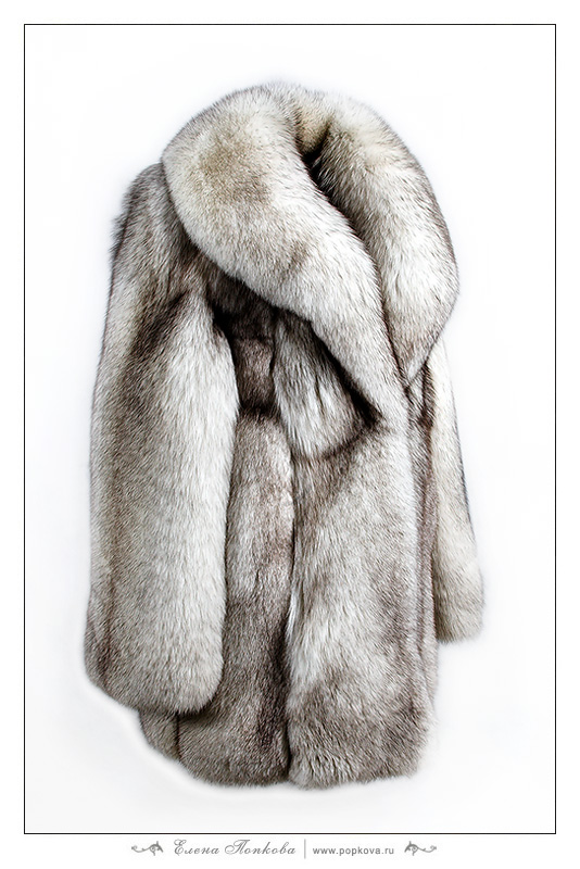 Female fur coat from fur of a polar fox